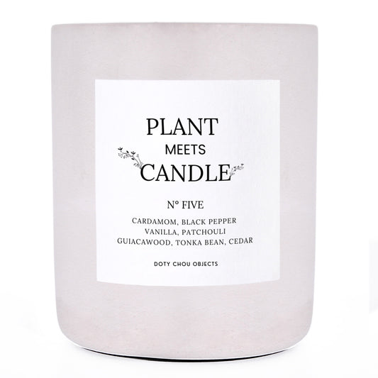 A light grey concrete candle vessel labelled as Plant Meets Candle No. Five.